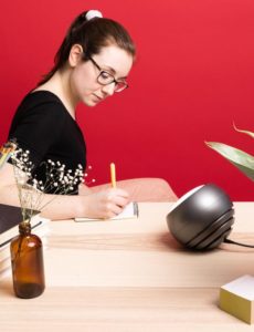 Person at desk with SAD lamp