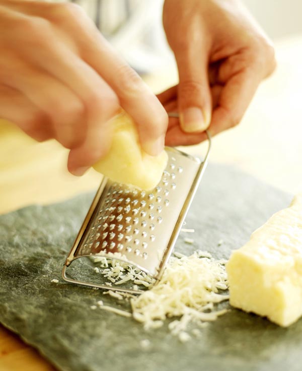 Cheese being grated