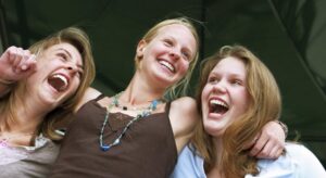 Three females looking happy